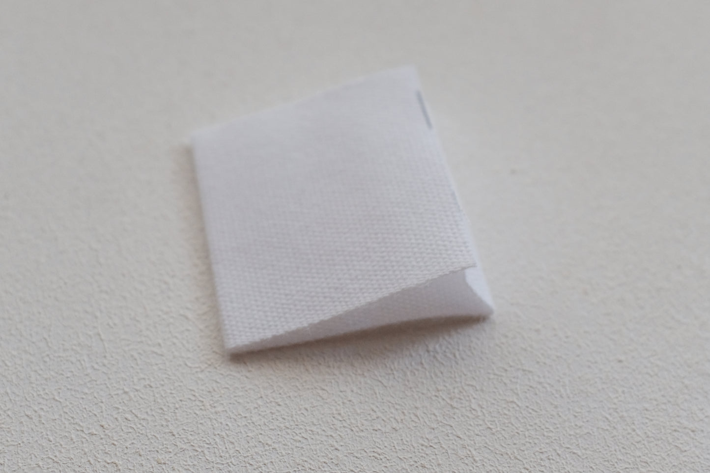 ONE STITCH AT A TIME コットンタグ